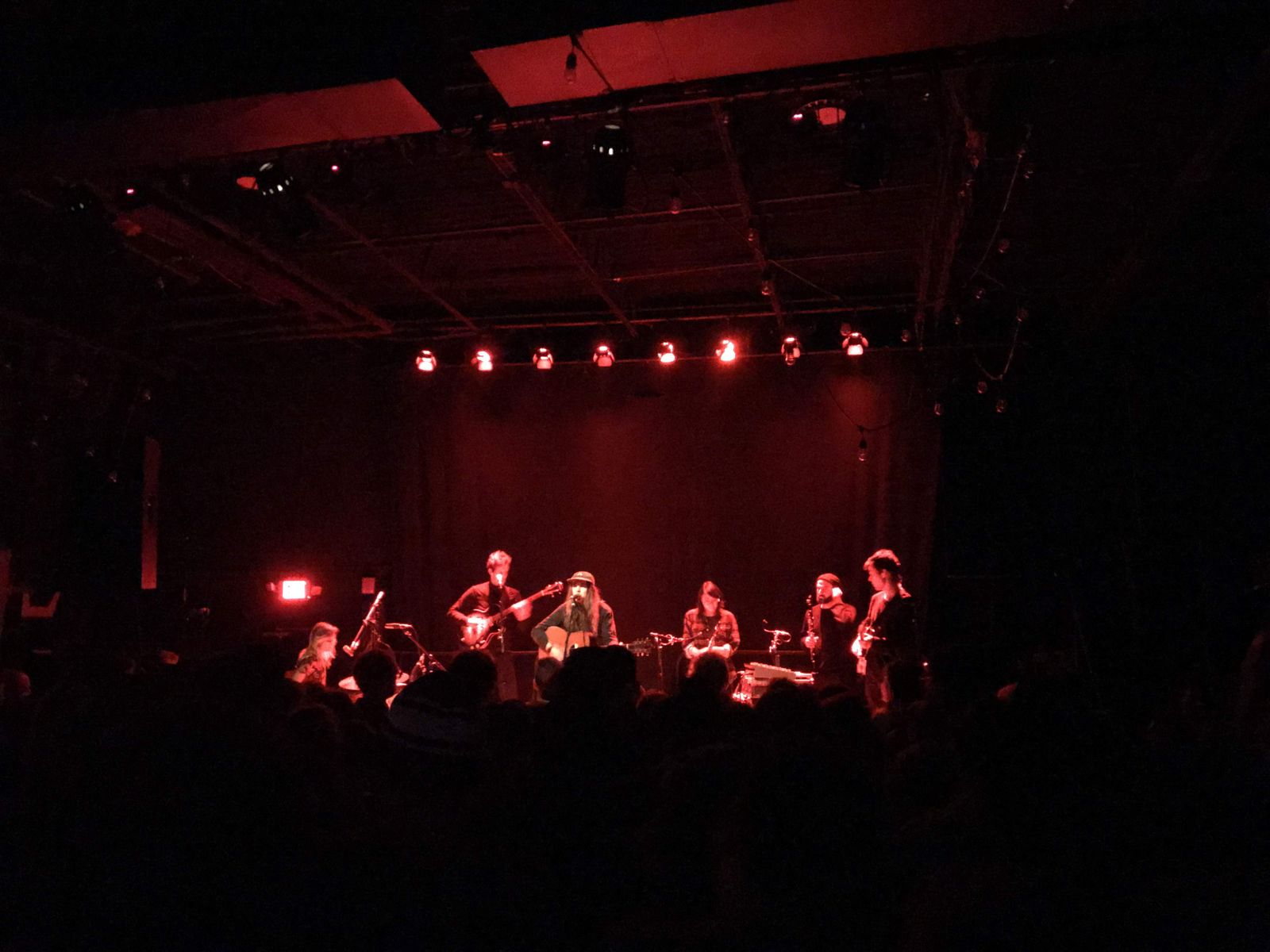 Andy and his band covered in red light