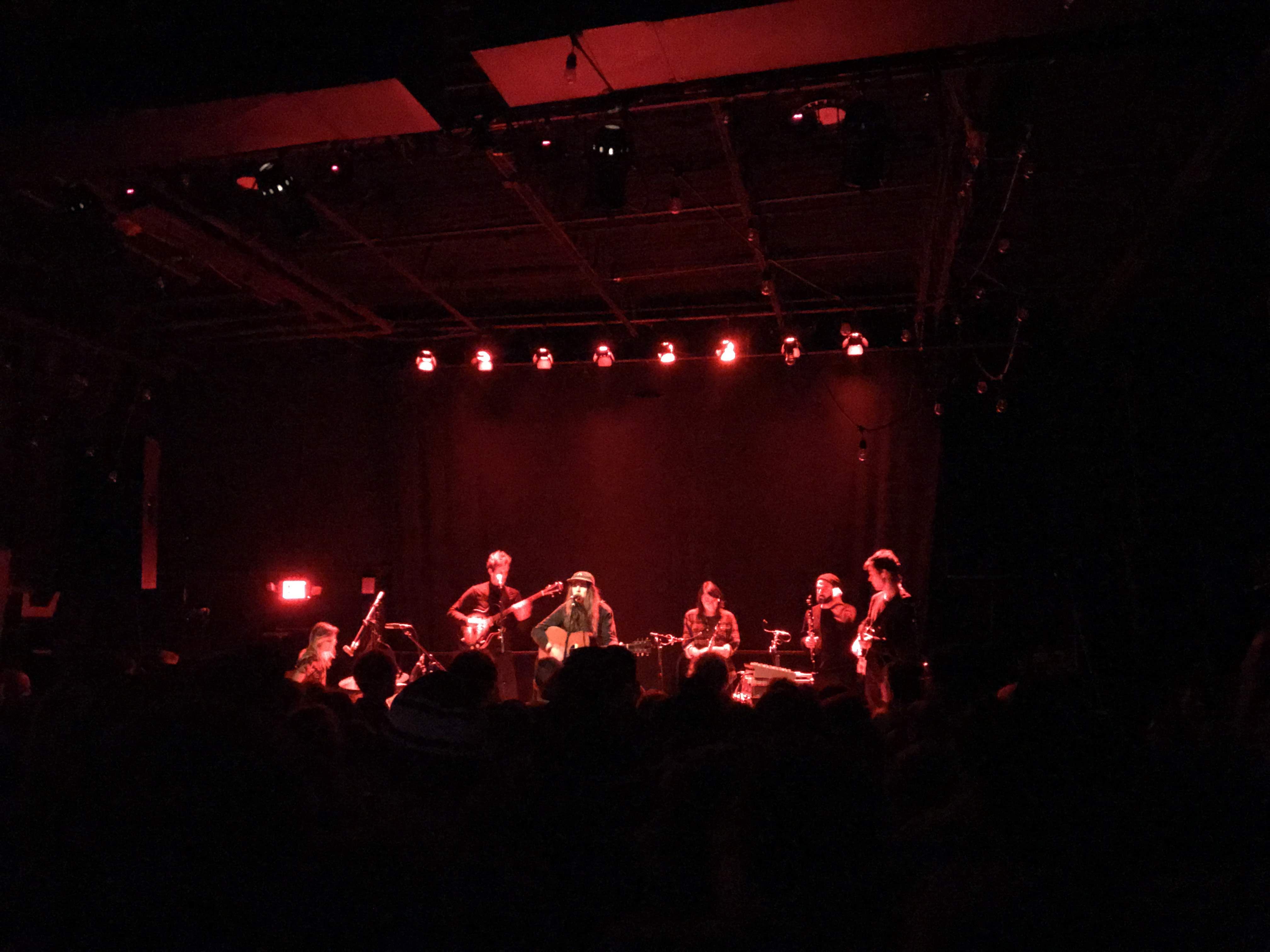 Andy and his band covered in red light