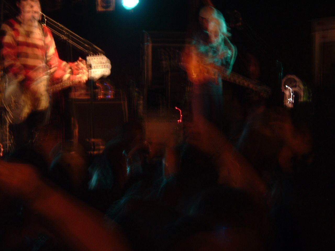 Brand New guitarist in a striped shirt on stage