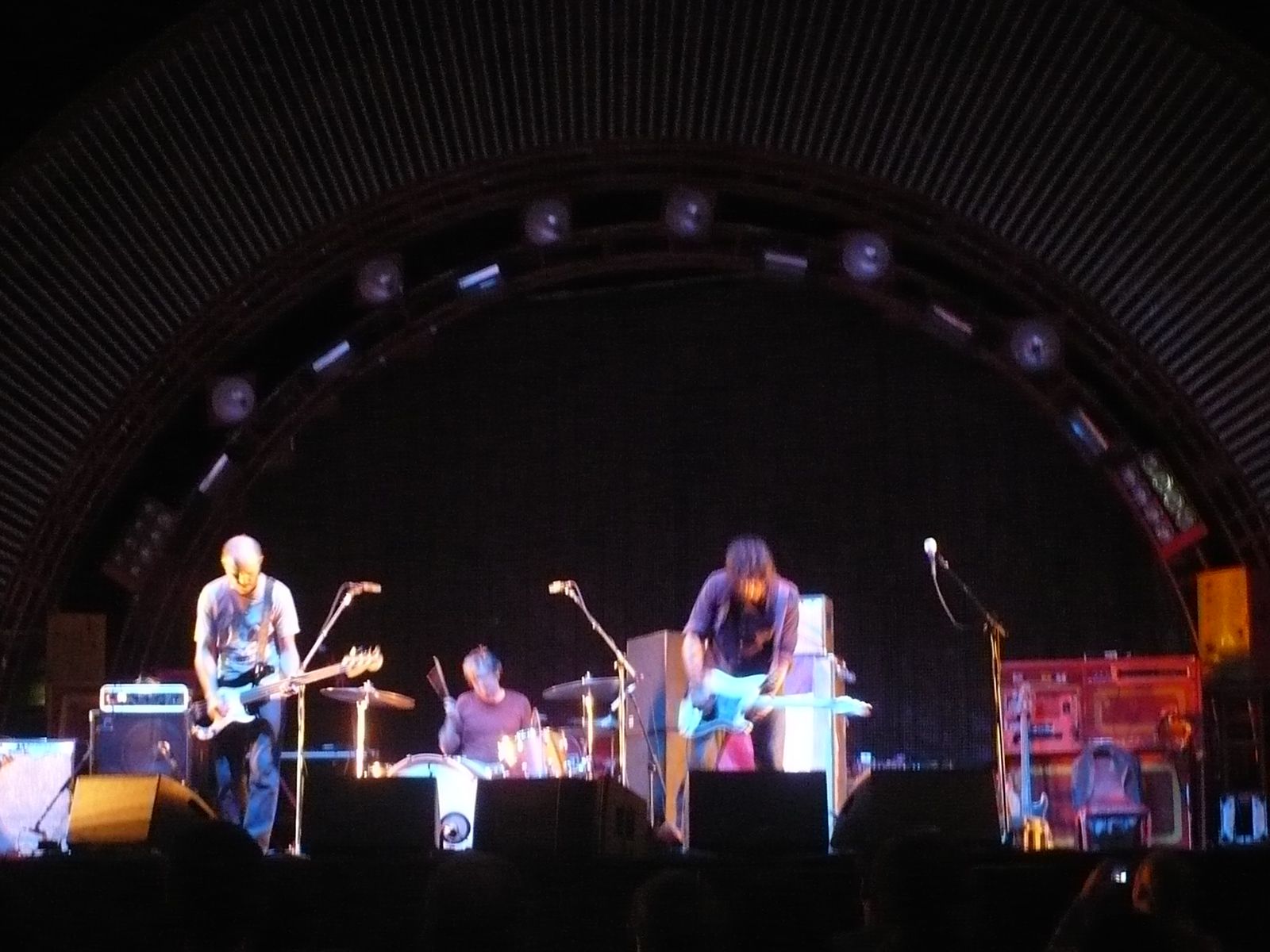 Stardeath and White Dwarfs performing under the arched stage roof at the Bank of America Pavilion