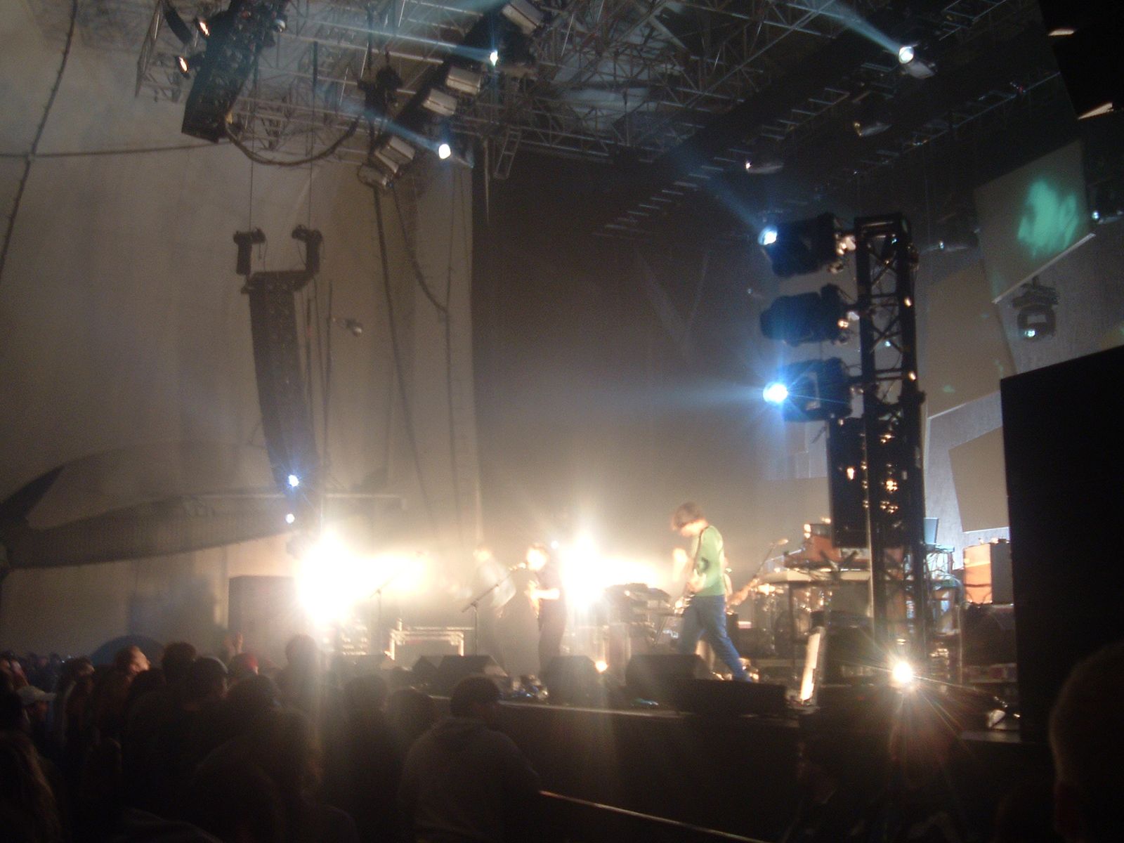 Thom Yorke in green shirt and blue pants at the Tweeter Center