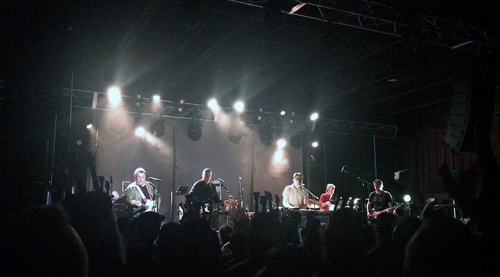 The band playing in a crowded venu
