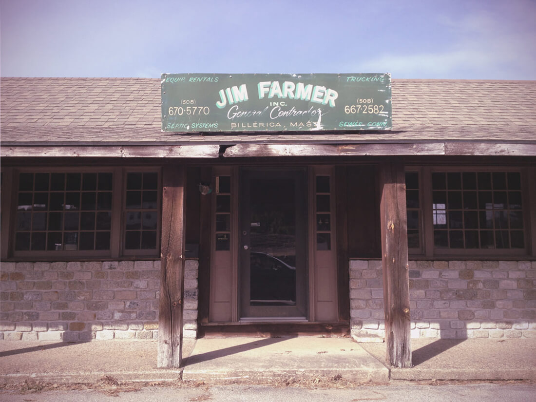  a feeding gym farmer, general contractor, sign above an abandoned shop