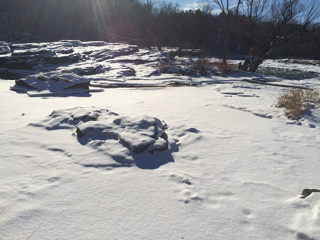  Snow covered rocks, and ice on the Winooski river